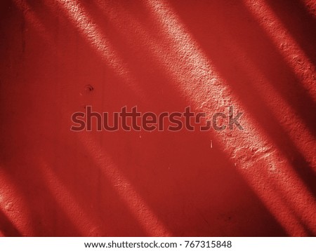 Light and shadow on the red background.