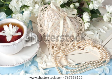 Jasmine green tea with pearl neclace and decorative heart -  March 8, valentine's day, mother's day, wedding theme 
