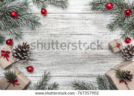Upper, top view, of a Christmas present on a wooden rustic background, with space for text writing.  Royalty-Free Stock Photo #767357902