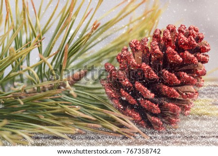 Christmas card with cone and pine spruce at wooden background. Christmas decoration with a snowflake, a pine, a fir tree and snow. Snow drawn. Greeting card with copy space.