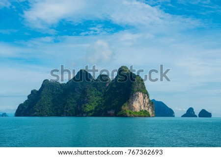 Tropical group of islands with limestone caves inside in Ao Phang-Nga National Park, Andaman Sea, Thailand.