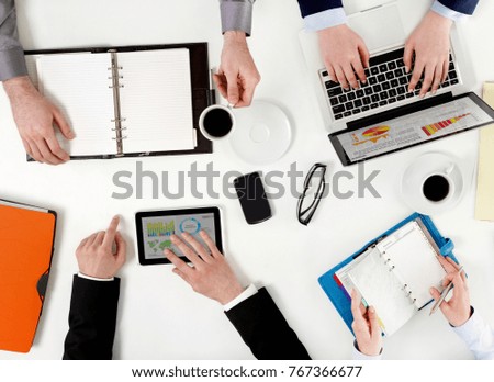 Co-workers in meeting at desk