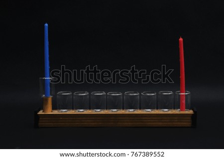 Hanukkah colored candles lighting