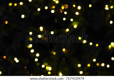 Small yellow dot bokeh at night for background, texture and pattern on Christmas celebration, greeting festival and New year