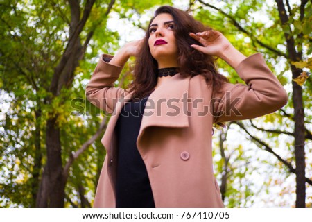 
girl in a golden autumn park