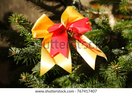 red-golden loop in a Christmas tree, Christmas decoration 
