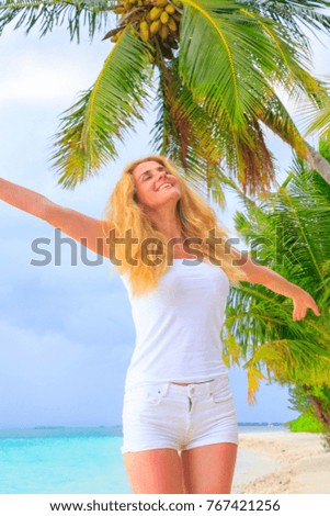 Blonde beauty woman at the beach on Maldives