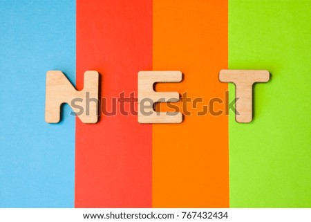 Word NET composed of 3D letters is in background of 4 colors: blue, red, orange and green. Domain designation or framework, short  of global network or the Internet. Design content for sites, blogs