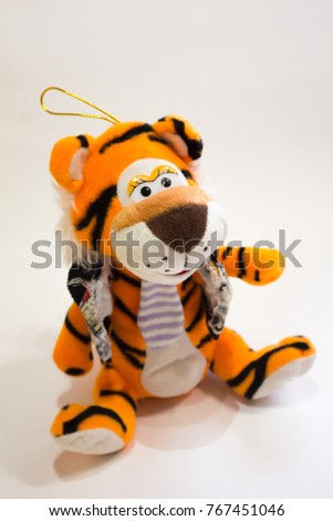 Soft toy tiger on a white background