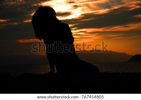 Silhouette of A Woman at sea side