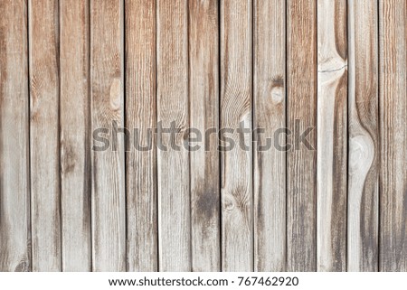 Texture of the wall from the wooden boards in natural color. Natural wooden background.