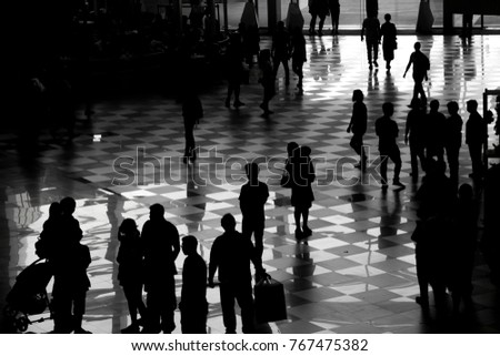 Black image or shadow image of peoples are shopping in the shopping mall at Christmas festival.
