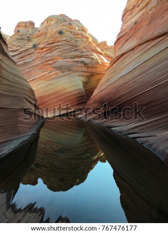 Reflection of The Wave in a pool of desert water.