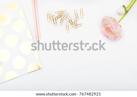 Workplace girl with pink and gold objects. Copy space