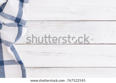 Table cloth blue on white table wood,top view and copy space for background