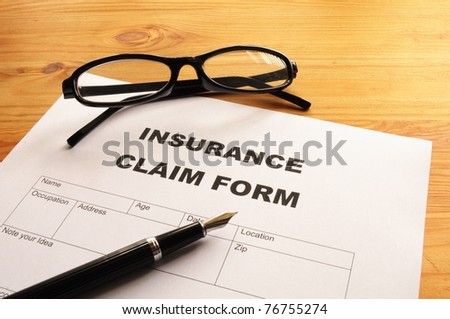 insurance claim for on desk in office showing risk concept