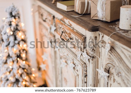 Christmas star and other decoration on ancient commode. Happy new year conception