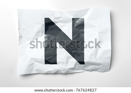 Grunge wrinkled paper letters on white background