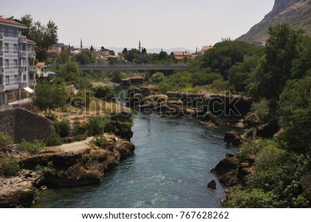 Landscape Picture on the beautiful and clean Neretva river in mediaeval Mostar city in south of Bosnia and Herzegovina country in Balkan region. City was destroyed during balkan war and rebuild again.