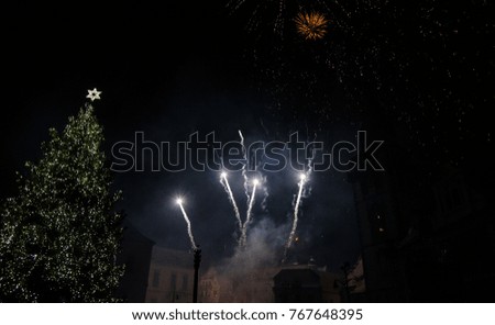 Colorful fireworks in the clouds and the beginning of Christmas time
