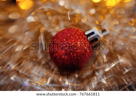Red Christmas tree decorations on lights background