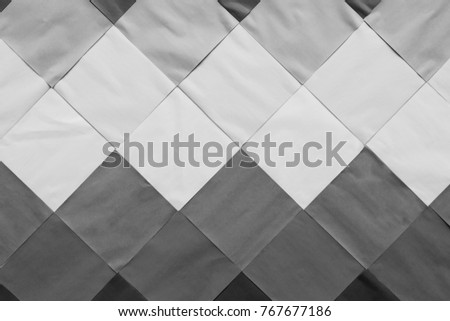 Close up a lot of paper that are covered on the cement wall in dark tone or black and white for design or creative working, Beautiful paper wall