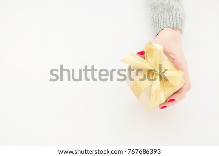 female hands giving the gift, top view, background for advertising space, copy space