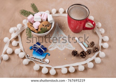 Christmas holiday background with gift box on the sled, coffee cup, cookies, cones, marshmallow, Christmas tree.