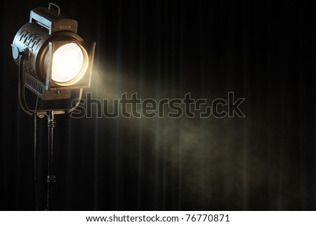 vintage theater spot light on black curtain with smoke Royalty-Free Stock Photo #76770871