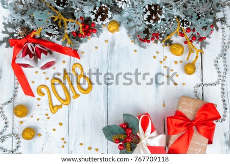 Christmas wooden background with snow branch. Top view with copy space for your text