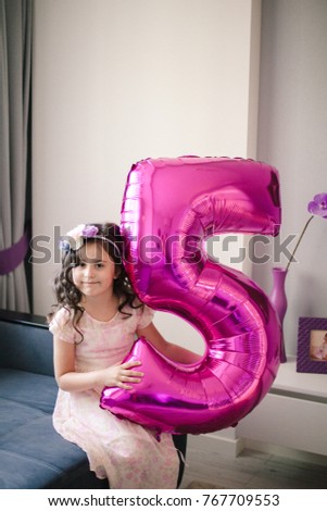 Happy little girl celebrating her birthday