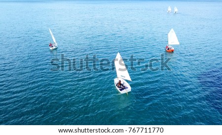 Aerial drone photo of small yachts operated by children in turquoise tropical waters