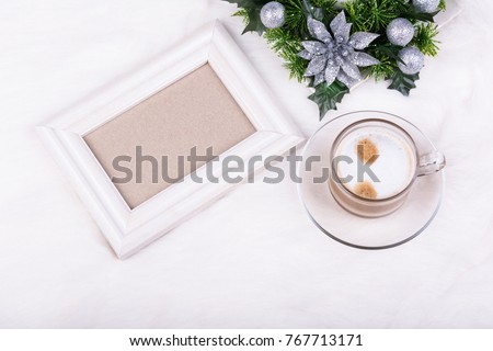 Christmas decoration, empty photo frame and latte coffee on white background. White frame mock-up.