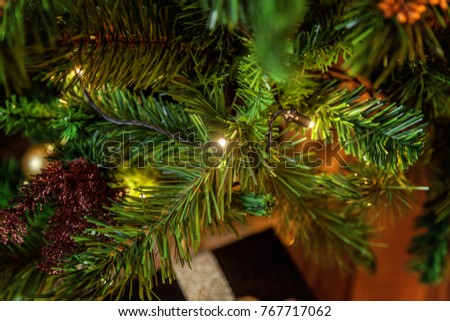 Classic christmas and New Year decorated Christmas tree with gold and black decorations closeup