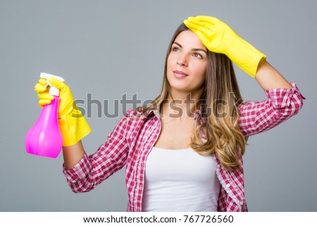 Young woman doing house cleaning.