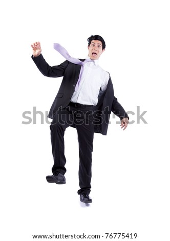 Scared businessman in a falling position (isolated on white)