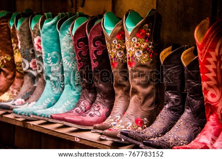 Cowboy Boots on a shelf Royalty-Free Stock Photo #767783152