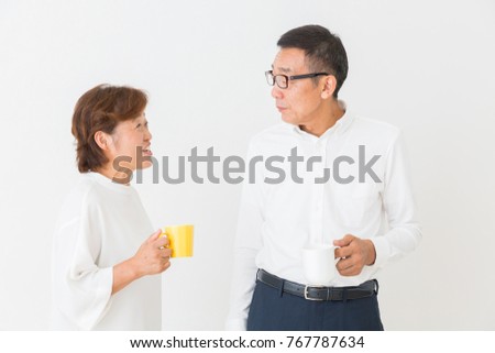 asian senior couple who drink coffee