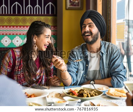 A group of Indian people is having lunch together Royalty-Free Stock Photo #767816935