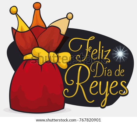 Red pouch like a present with golden ribbon over a night view of the Bethlehem star to celebrate Dia de Reyes (written in Spanish).