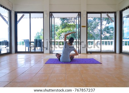 Yoga girl in a large room Natural environment