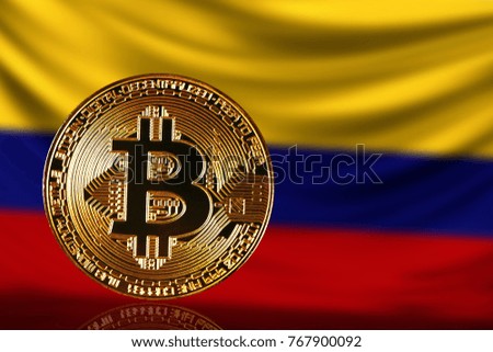 gold coin bitcoin on a background of a flag Colombia
