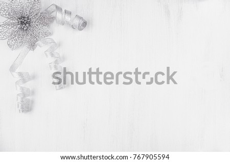 Christmas glitter silvery decoration on white modern background, top view.