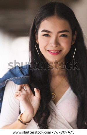Asian portrait cute young girl Jeans in the building
