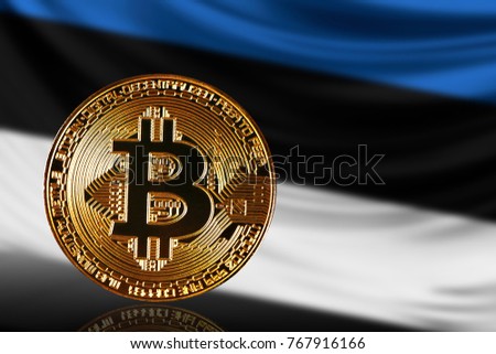 gold coin bitcoin on a background of a flag Estonia