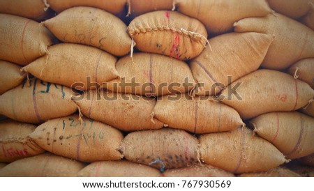 Jute bag in store containing grains Royalty-Free Stock Photo #767930569