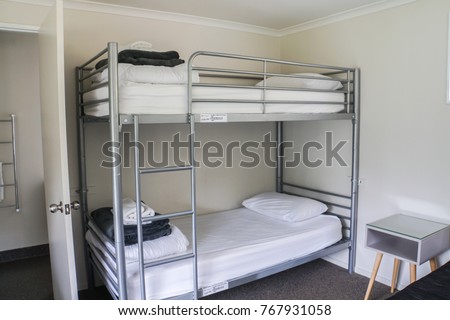 white plain bunk bed in dormitory Royalty-Free Stock Photo #767931058