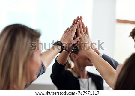 Picture showing business people joining hands