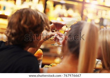 Picture showing group of friends enjoying drink in bar