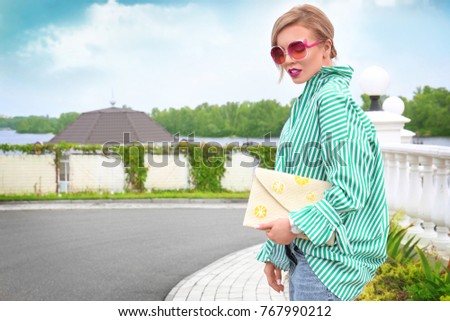 Beautiful woman wearing green outdoors